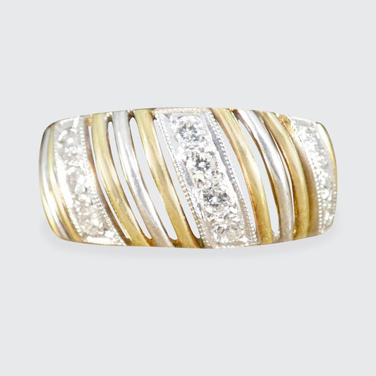 A chunky diamond set gold ring