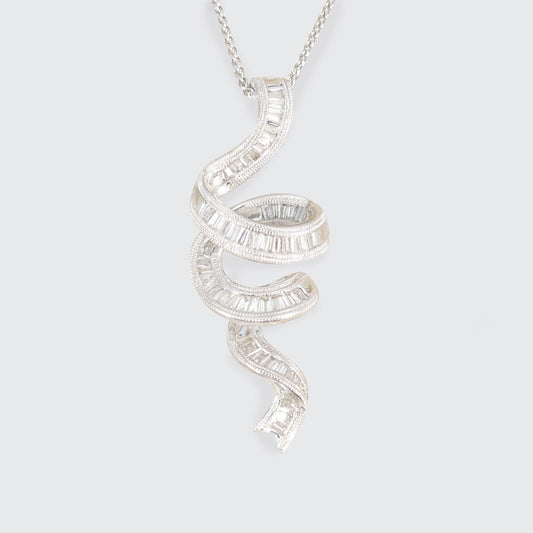 Diamond Set Ribbon shaped pendant necklace on a light gray background