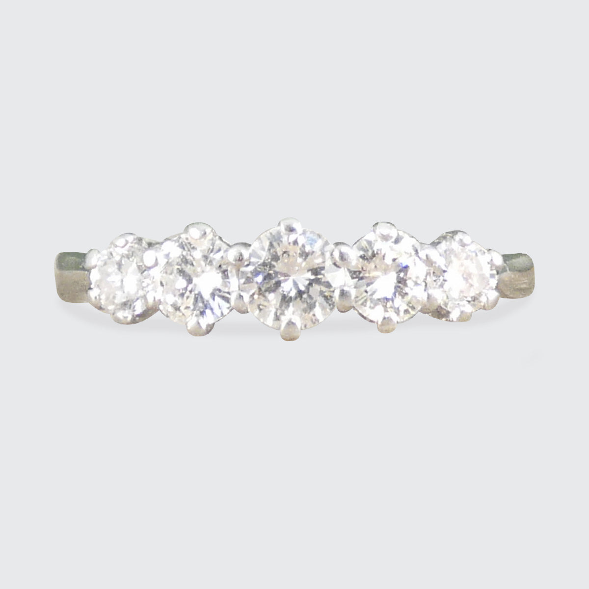 A graduated diamond five stone ring in 18ct white gold