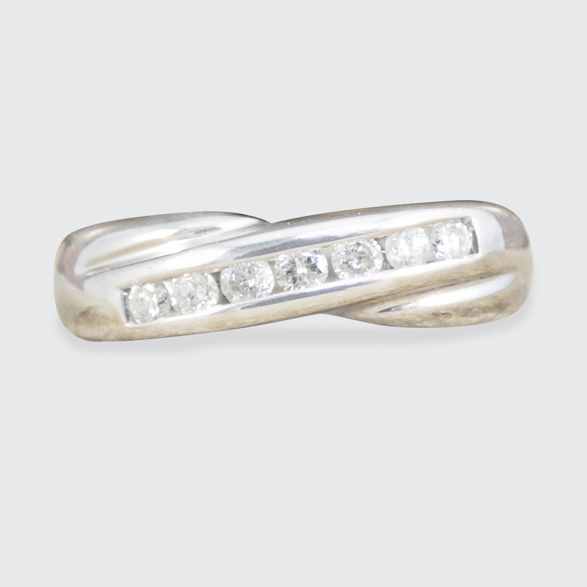 Diamond set wishbone twist ring