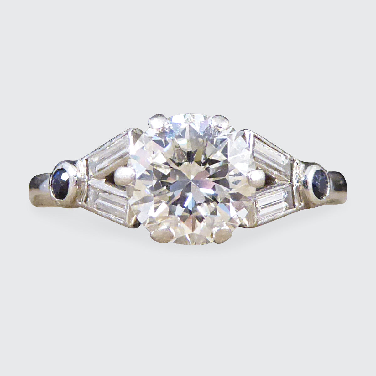 Art Deco 1.10ct Diamond Solitaire Engagement Ring with Diamond and Sapphire Shoulders in Platinum - Wharfedale Antiques