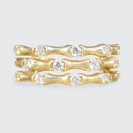 Three strand bamboo style ring in yellow gold with diamonds