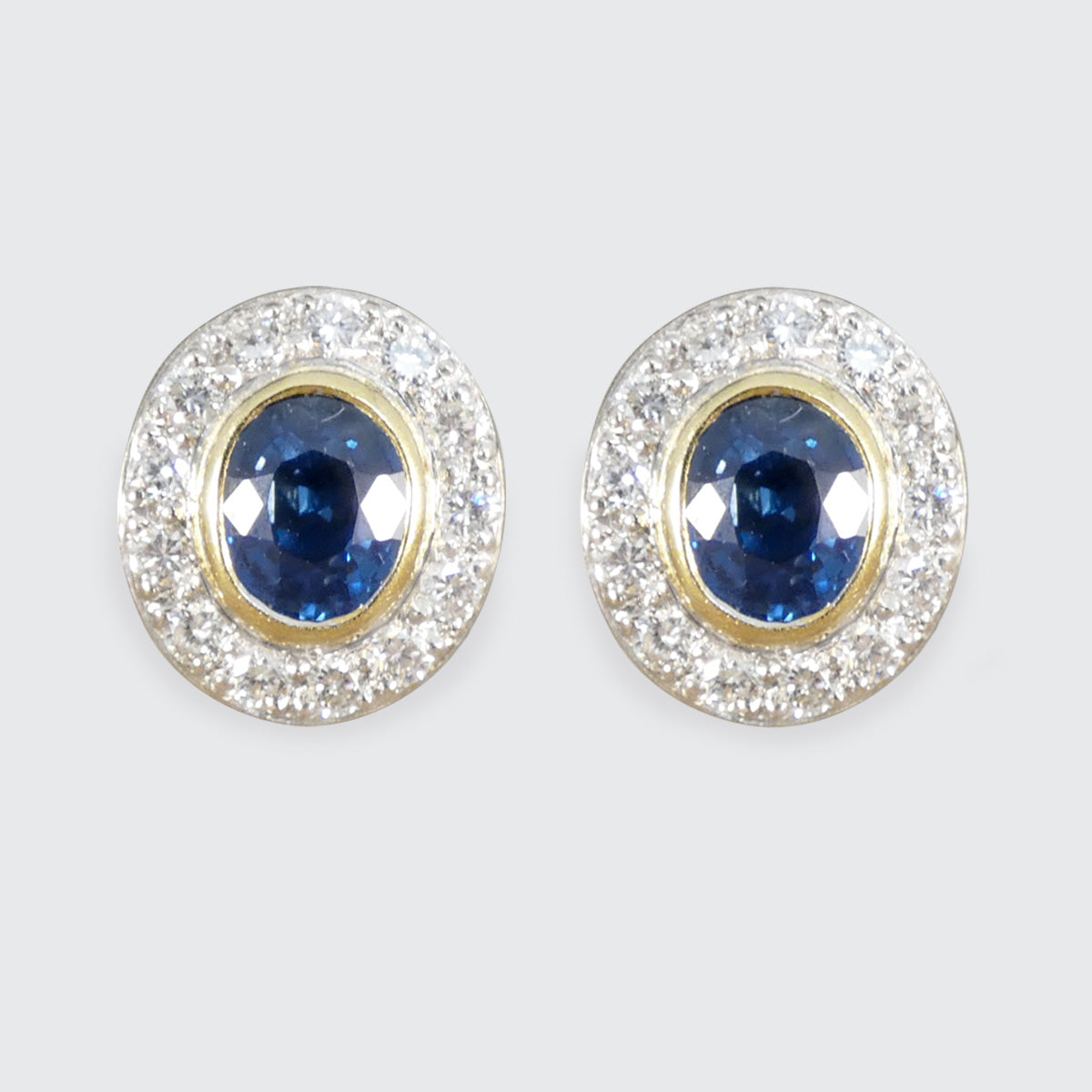 Oval Cut Sapphire and Diamond Cluster Stud Earrings in 18ct Gold