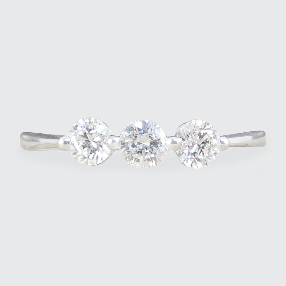 A bright and beautiful diamond three stone ring set in 18ct white gold.