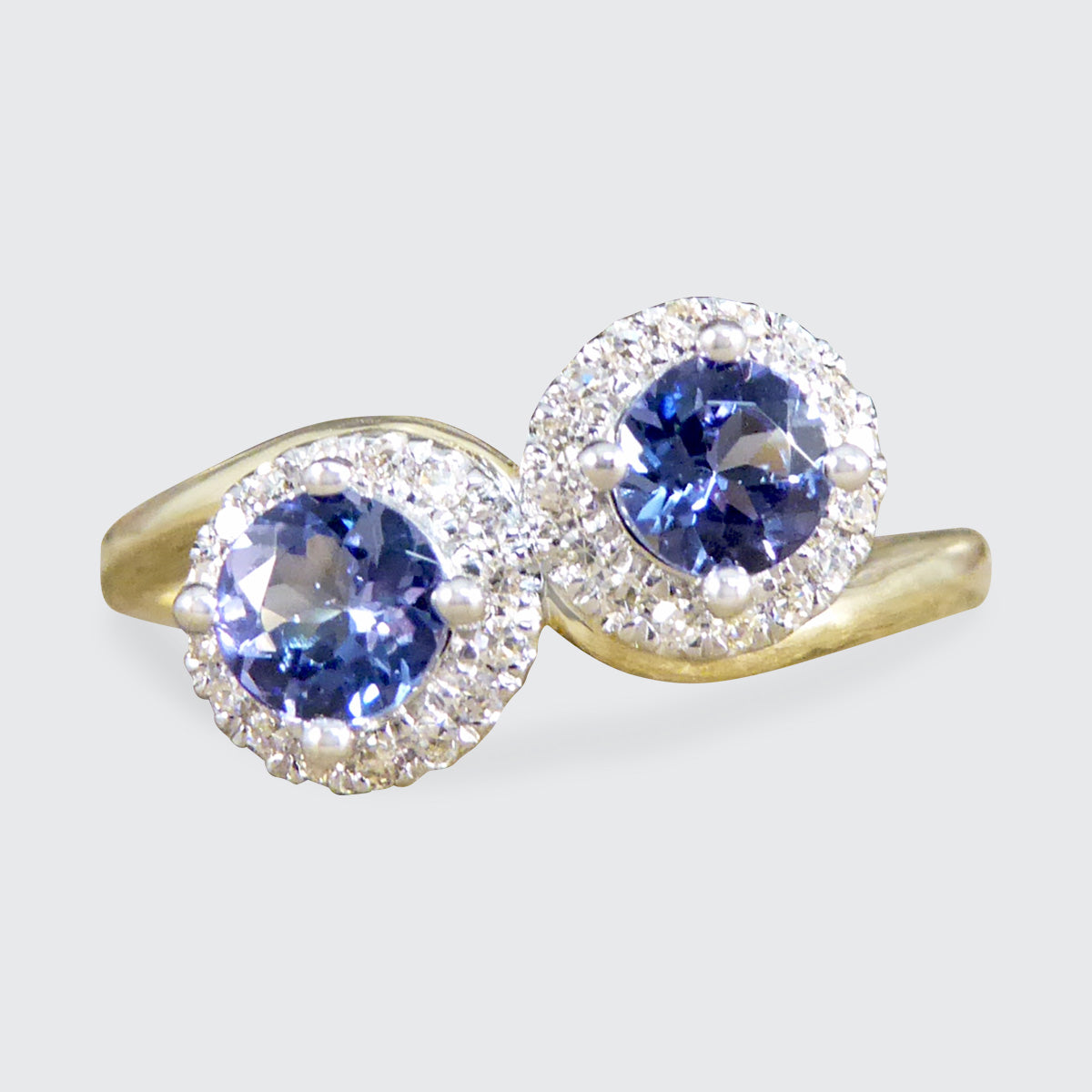 Edwardian Style Tanzanite and Diamond Cluster Toi Et Moi Twist Ring in Yellow and White Gold - Wharfedale Antiques