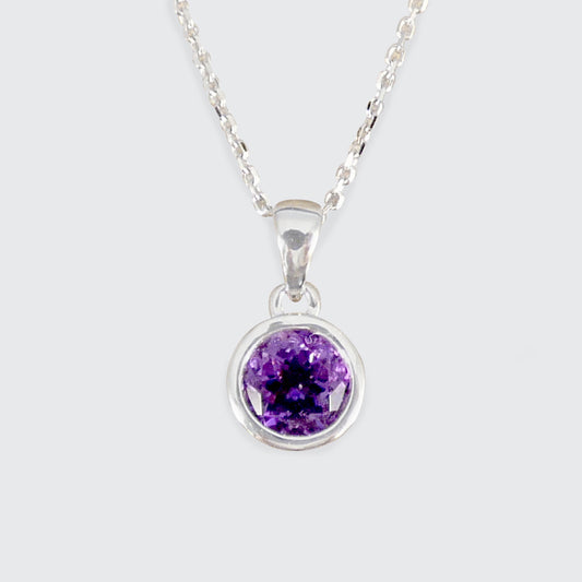 Silver necklace with a amethyst gemstone pendant on a white background