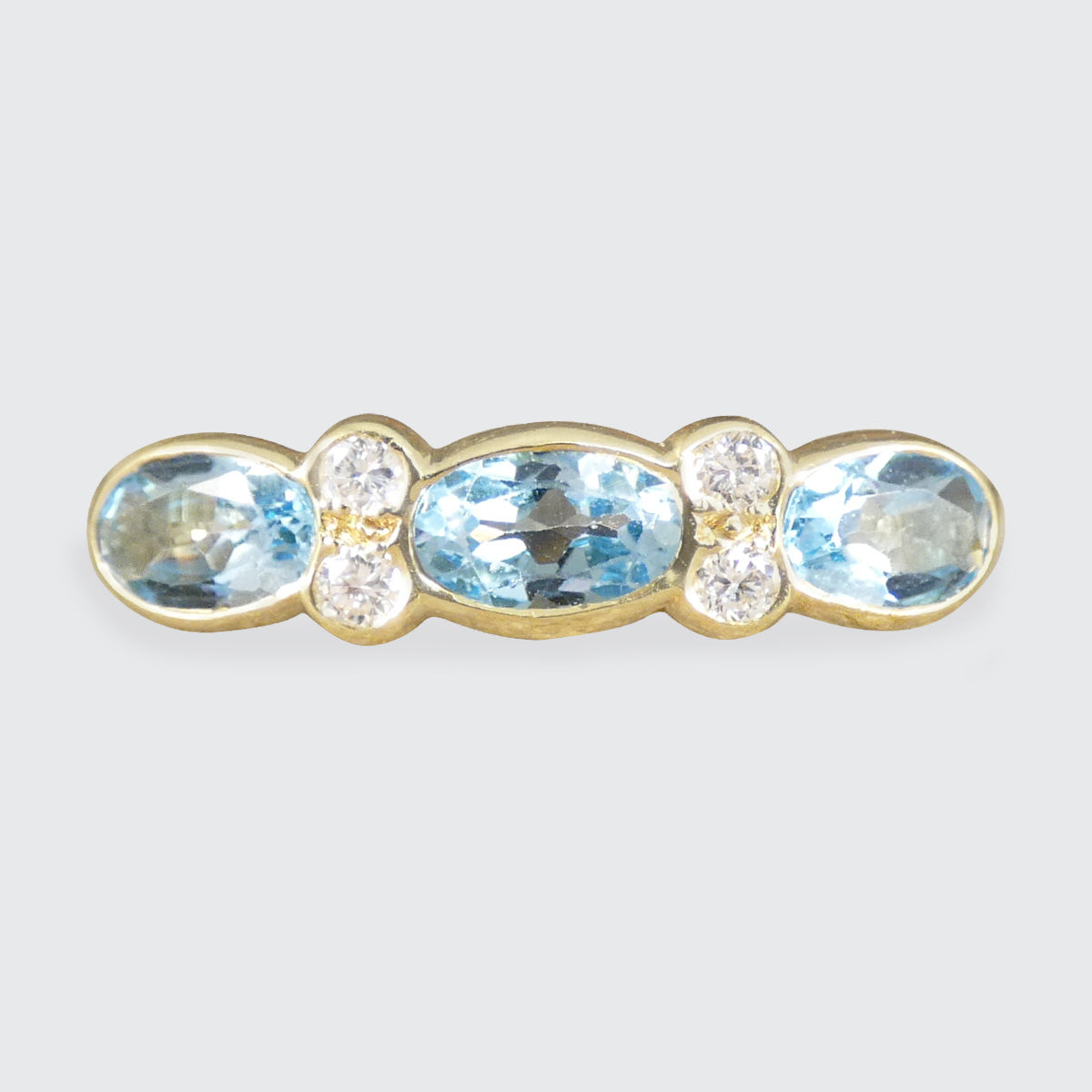 Blue Topaz and Diamonds ring in Yellow Gold