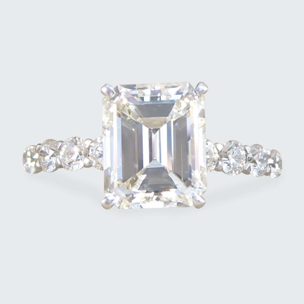 2.60ct Emerald Cut Diamond Solitaire Ring with 0.60ct Diamond Shoulders in Platinum - Wharfedale Antiques