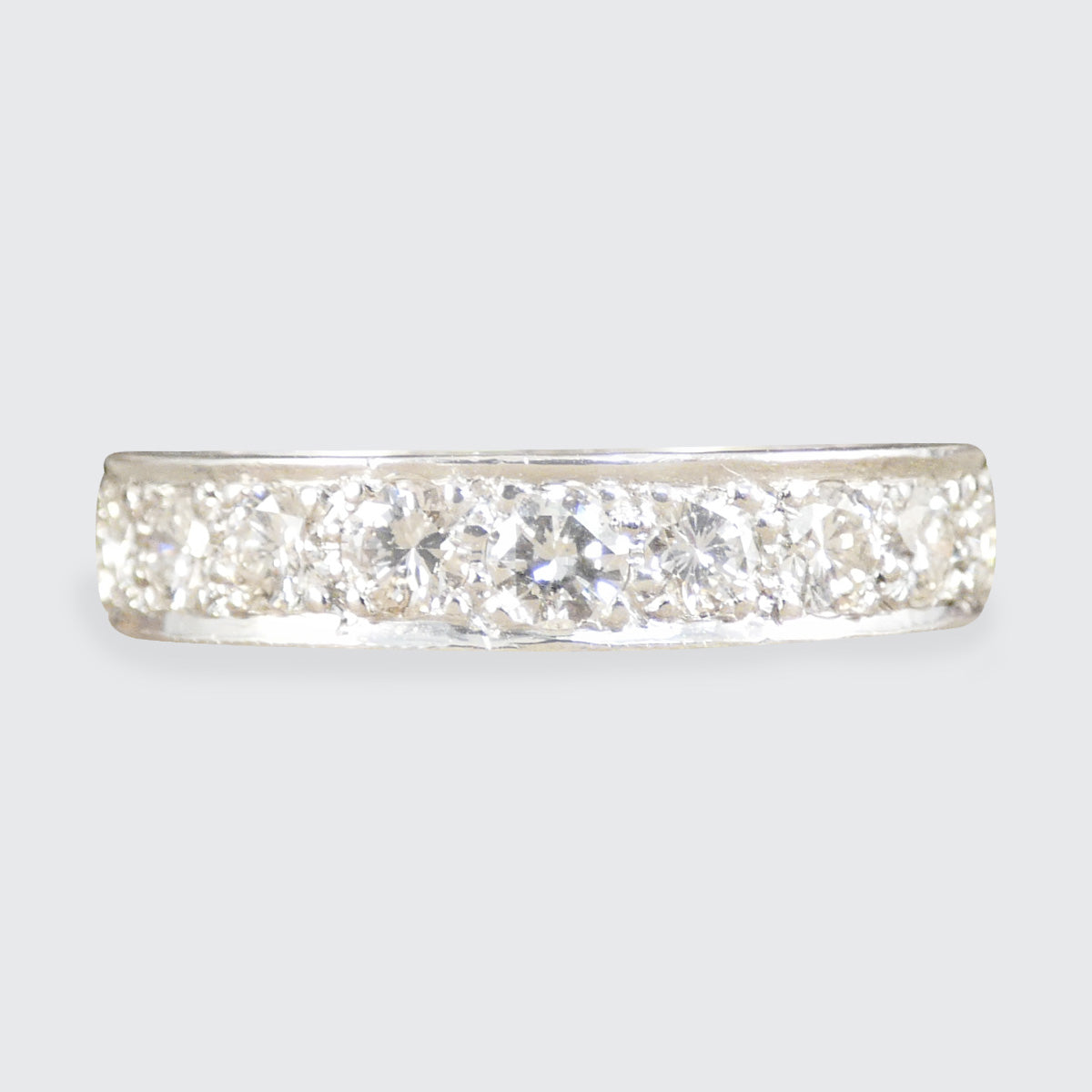 a diamond full eternity ring in white metal