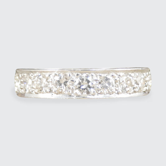 a diamond full eternity ring in white metal