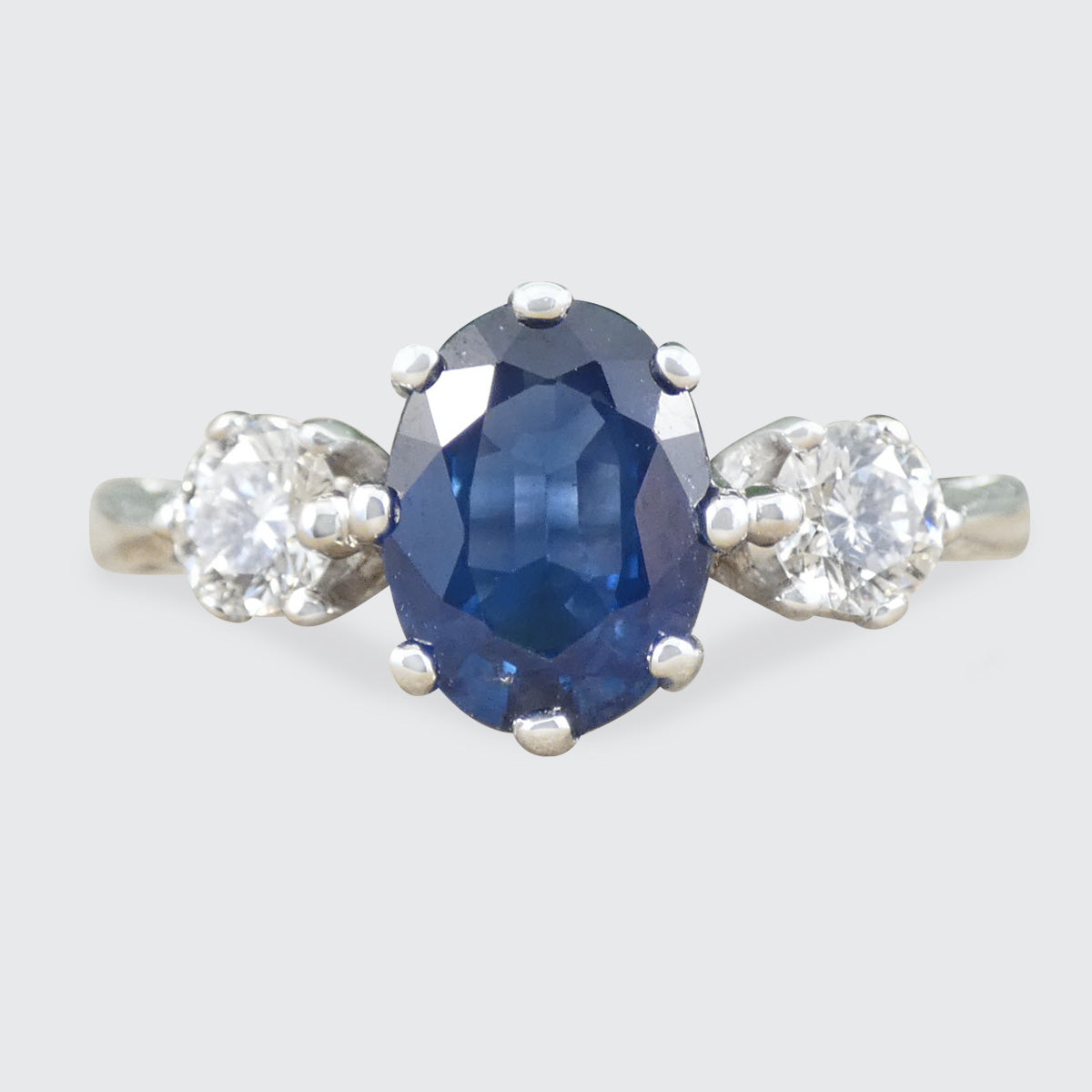 A Sapphire and Diamond Three Stone Ring 