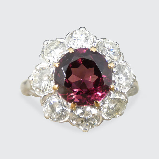 2.00ct Pyrope Garnet and 1.40ct Brilliant Cut Diamond flower cluster ring in 18ct White Gold with Yellow Gold claws on the Garnet.