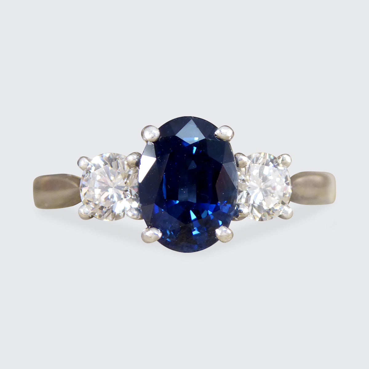 Oval Cut 1.75ct Sapphire and Diamond Three Stone Ring in Platinum - Wharfedale Antiques