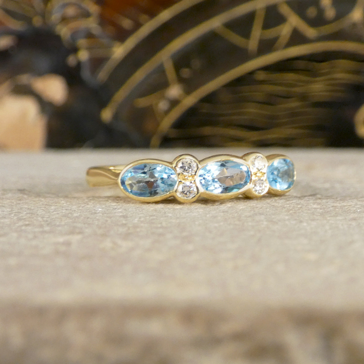 Blue Topaz and Diamonds ring in Yellow Gold