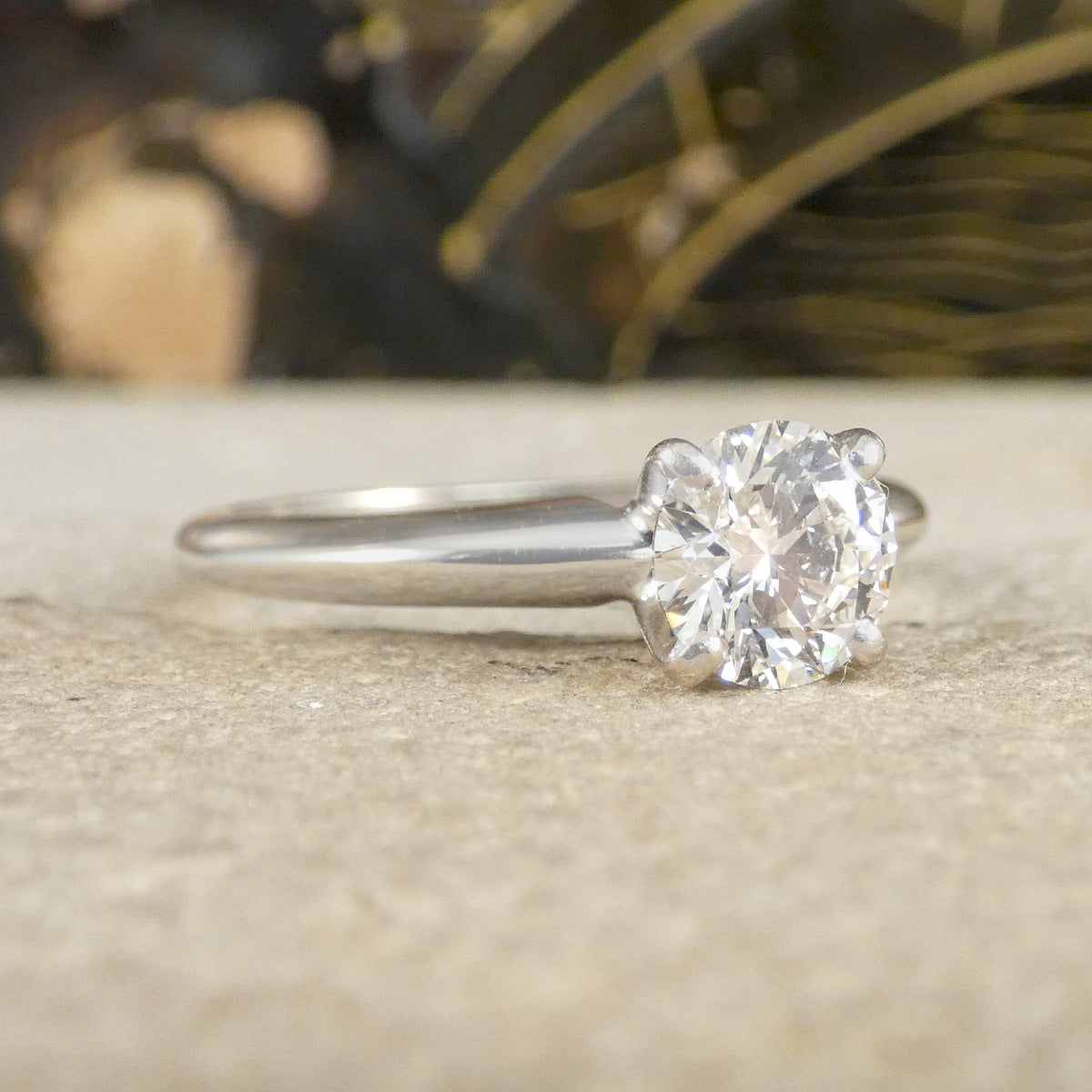 A diamond solitaire high set ring in white gold