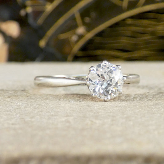 An old cut diamond solitaire ring in 18ct white gold and platinum