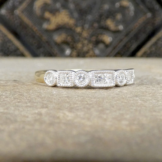 Diamond ring on a textured surface with a decorative background
