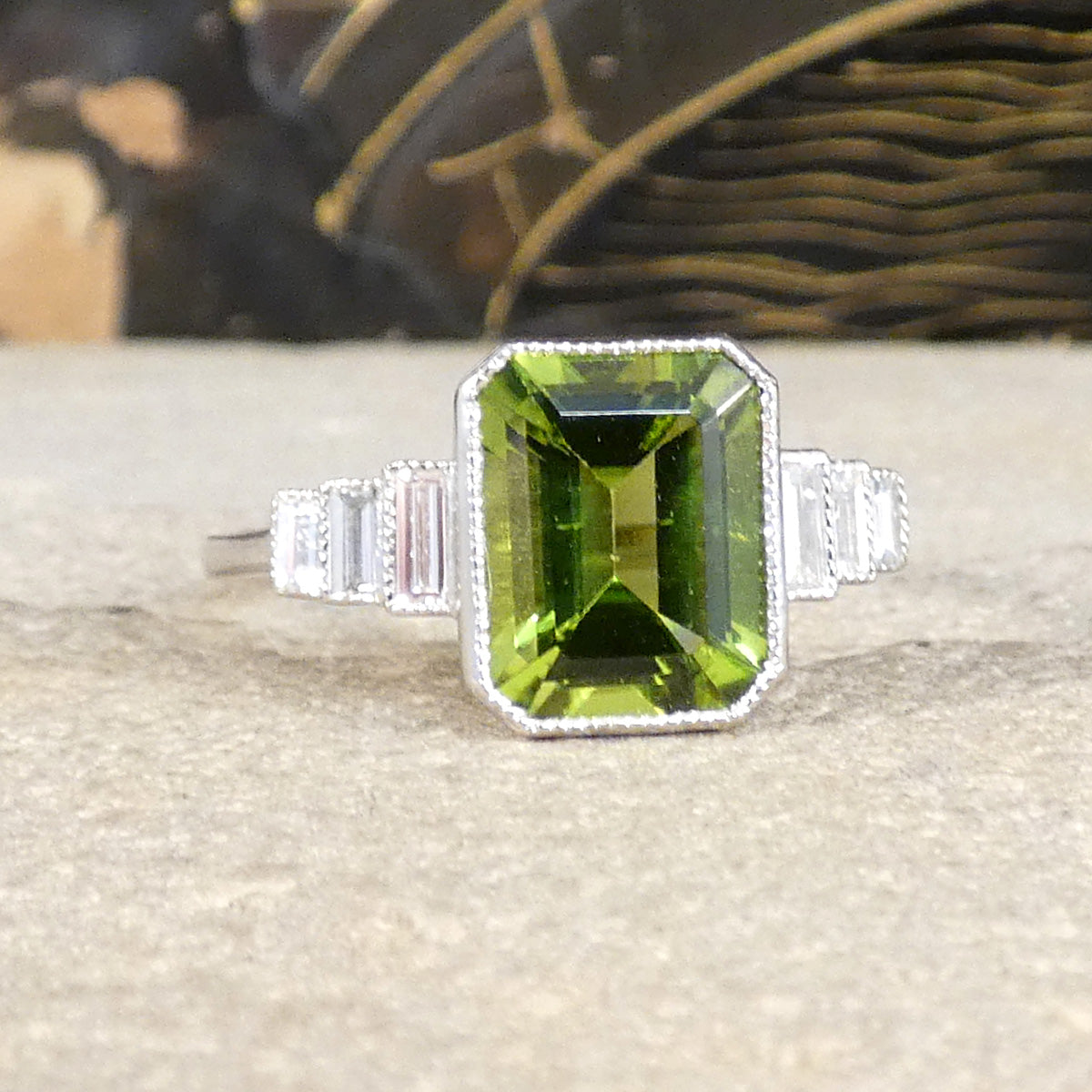 Art Deco Inspired Peridot and Baguette Cut Diamond Staged Shoulders in Platinum