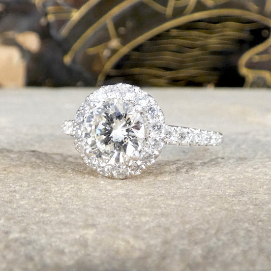 Diamond ring on a textured surface with a blurred background
