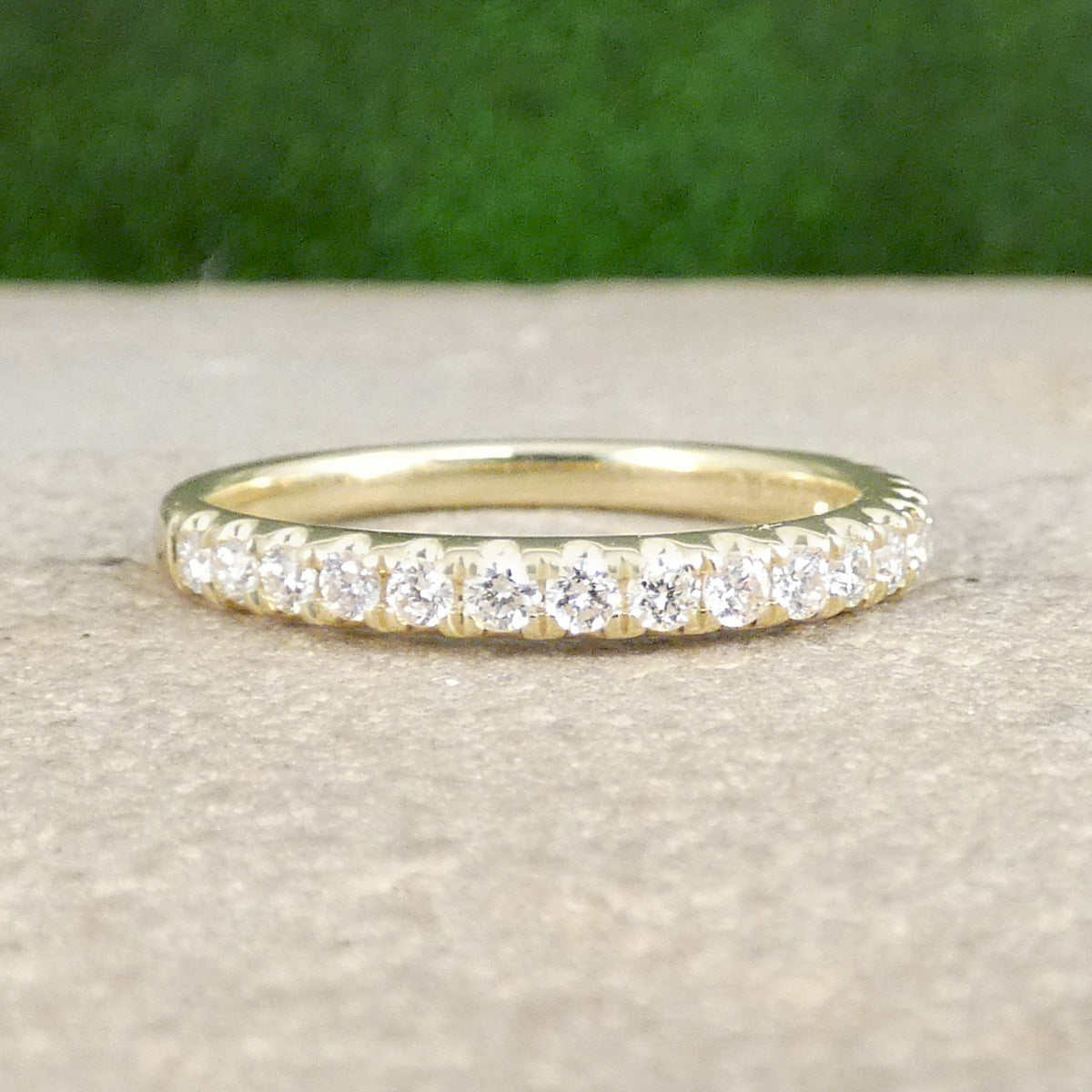 A diamond half eternity ring in yellow gold, perfect stacking ring