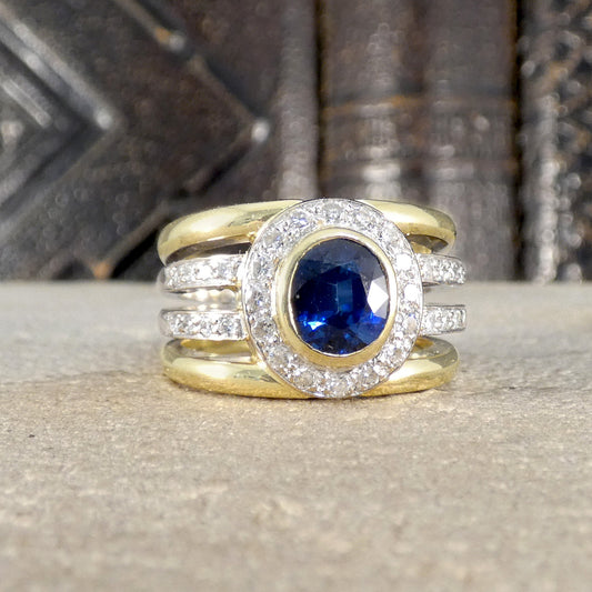 A chunky ring set with a Sapphire centre with a halo of diamonds.