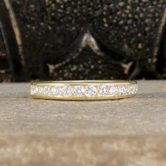 Channel Set Brilliant Cut Diamond Half Eternity Ring modelled in 9ct yellow gold for durability. 