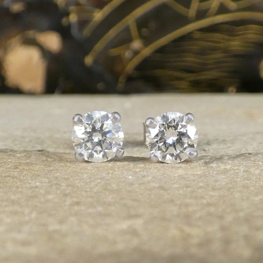 A pair of GIA certified Diamond stud earrings in platinum