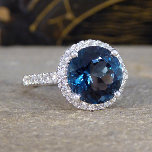 London Blue Topaz and Diamond Halo Cluster Ring in Platinum with Diamond set Shoulders - Wharfedale Antiques