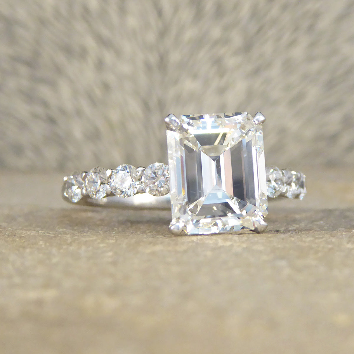 2.60ct Emerald Cut Diamond Solitaire Ring with 0.60ct Diamond Shoulders in Platinum - Wharfedale Antiques