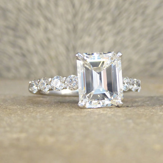 2.60ct Emerald Cut Diamond Solitaire Ring with 0.60ct Diamond Shoulders in Platinum - Wharfedale Antiques