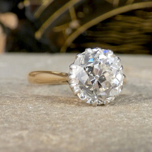 An Old Cushion shaped Mine cut diamond solitaire ring. 