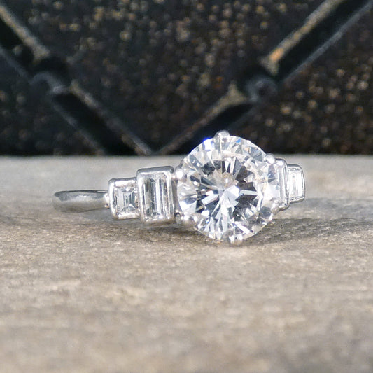 Art Deco 1.20ct Early Brilliant Cut Diamond Solitaire with Baguette Cut Shoulders in Platinum - Wharfedale Antiques