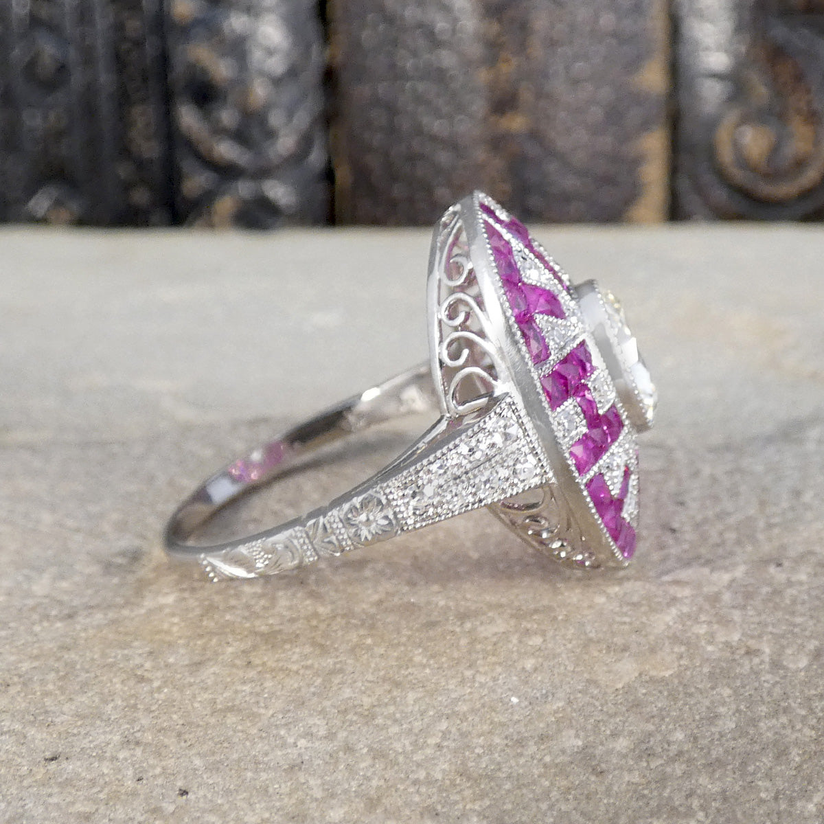 Side view of Ruby and Diamond Art Deco style ring showing detailed gallery and shoulders.