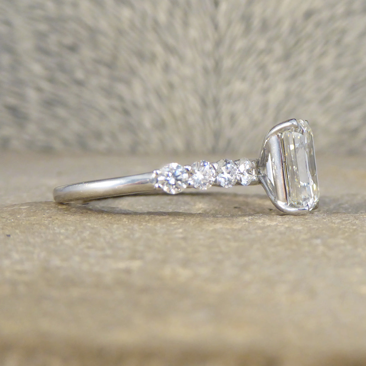 2.60ct Emerald Cut Diamond Solitaire Ring with 0.60ct Diamond Shoulders in Platinum - Wharfedale Antiques