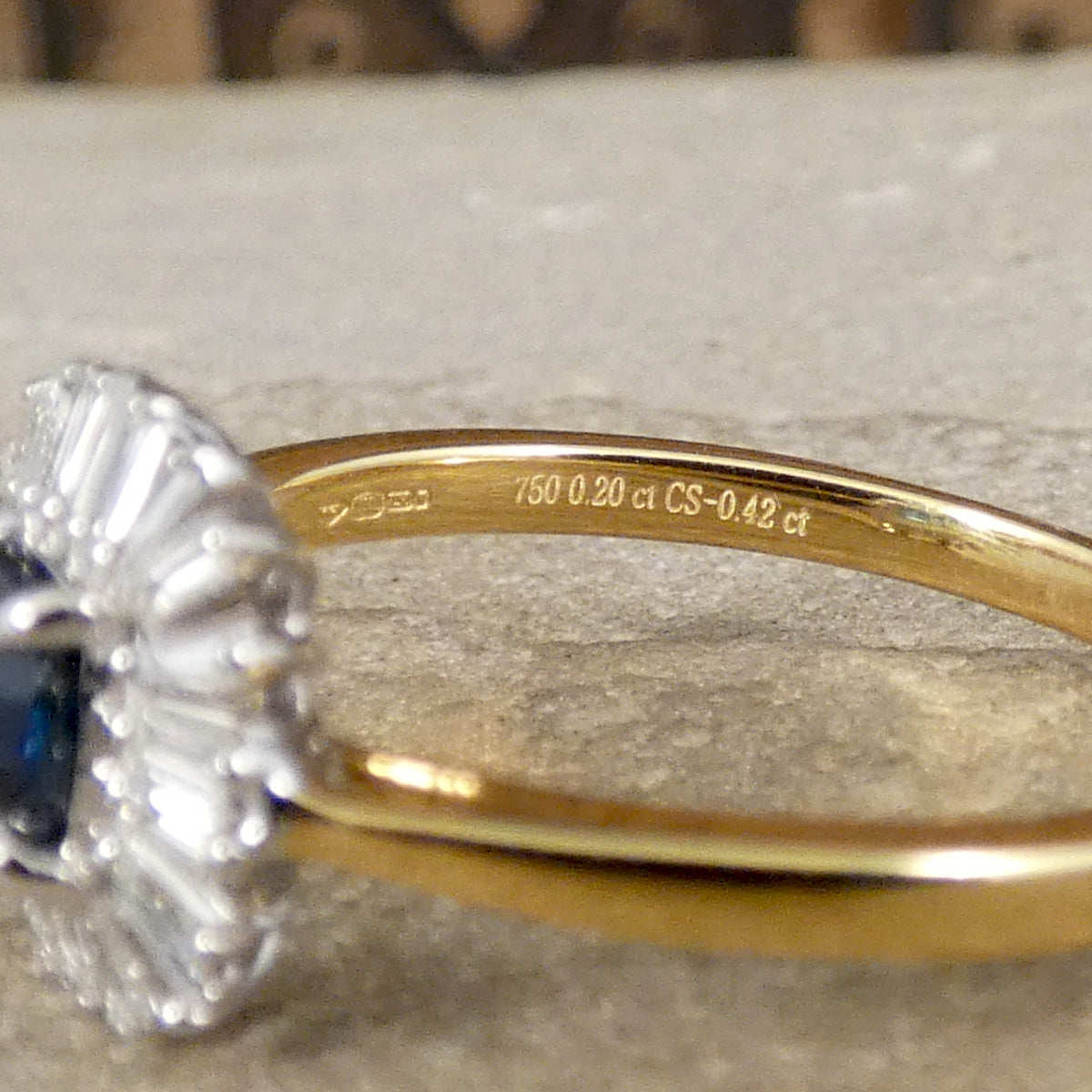 Hallmark and gem weights on the inside of the band showing 18ct Yellow Gold, 0.20ct Diamond total and 0.42ct Ceylon Sapphire total.