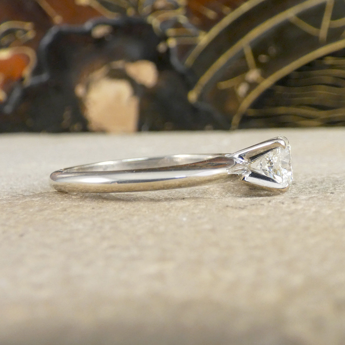 A diamond solitaire high set ring in white gold