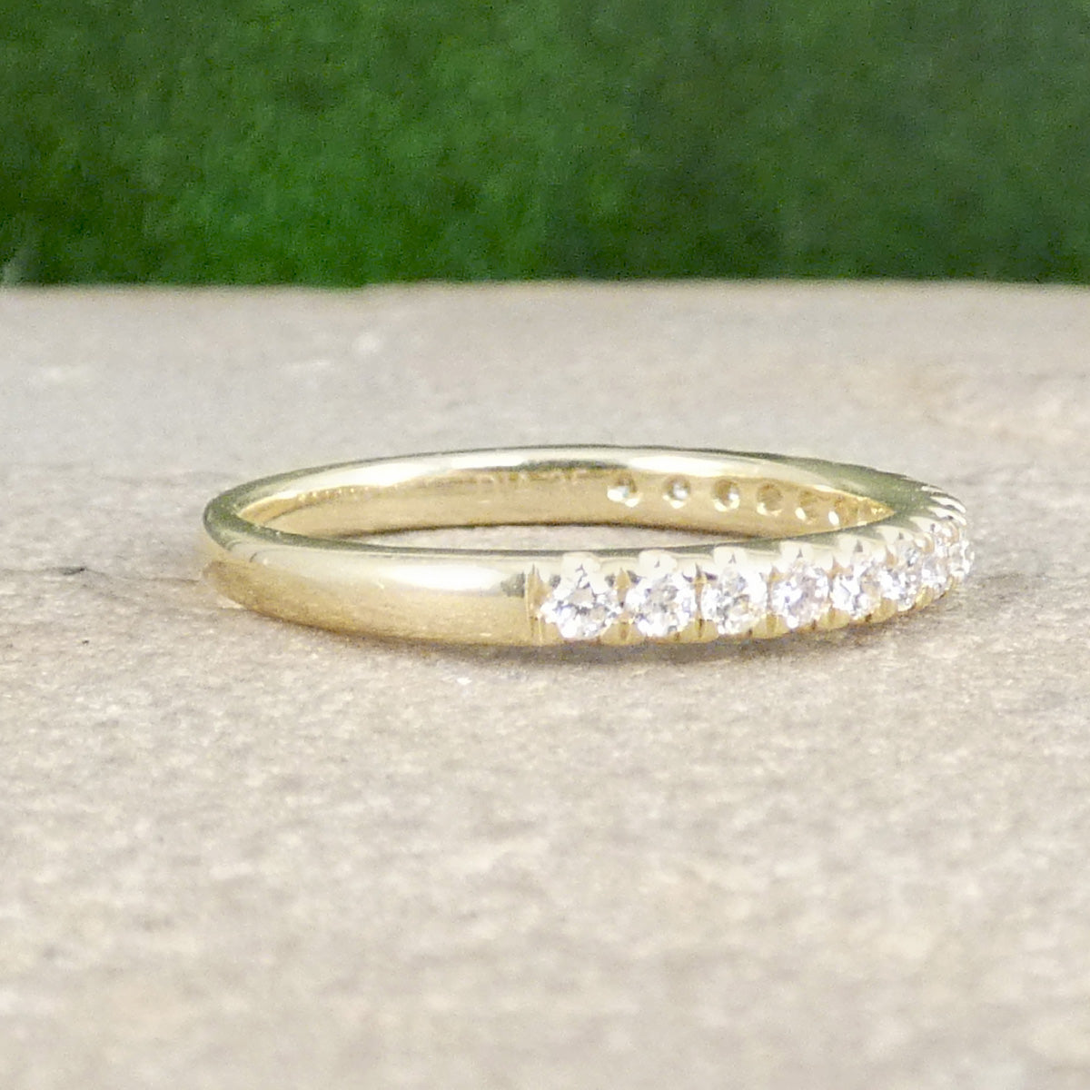 A diamond half eternity ring in yellow gold, perfect stacking ring