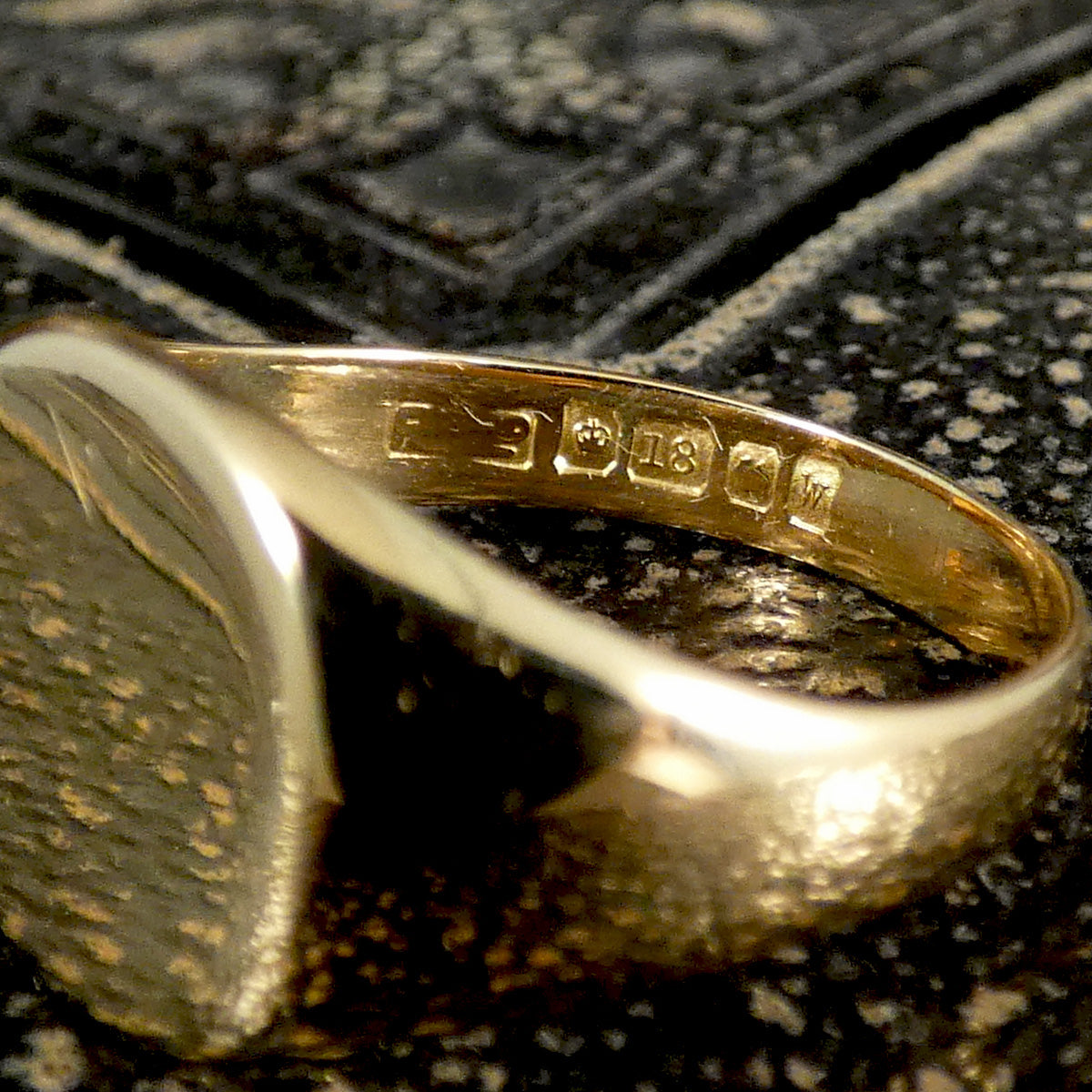 Clear hallmarks on the inner band showing 18ct yellow gold which a buttery gold hue.