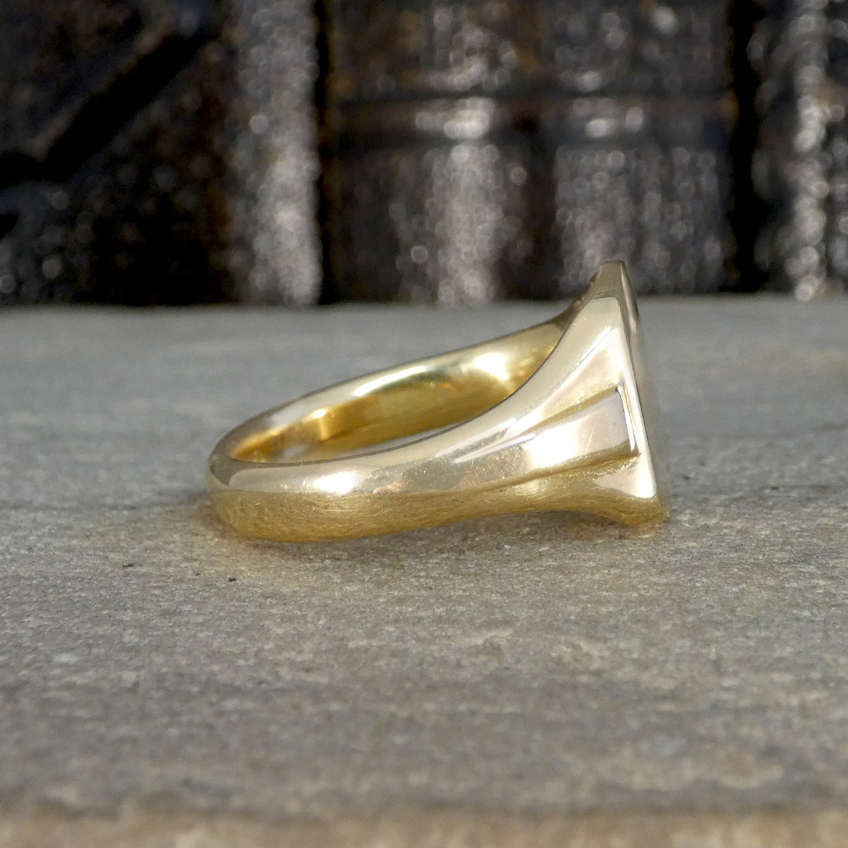 Side view of 18ct Yellow Gold signet ring with a chunky band.