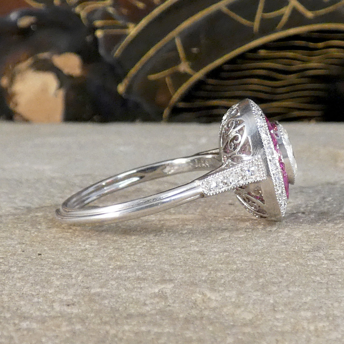 Side view of cluster ring showing detail on the shoulders with Diamonds set