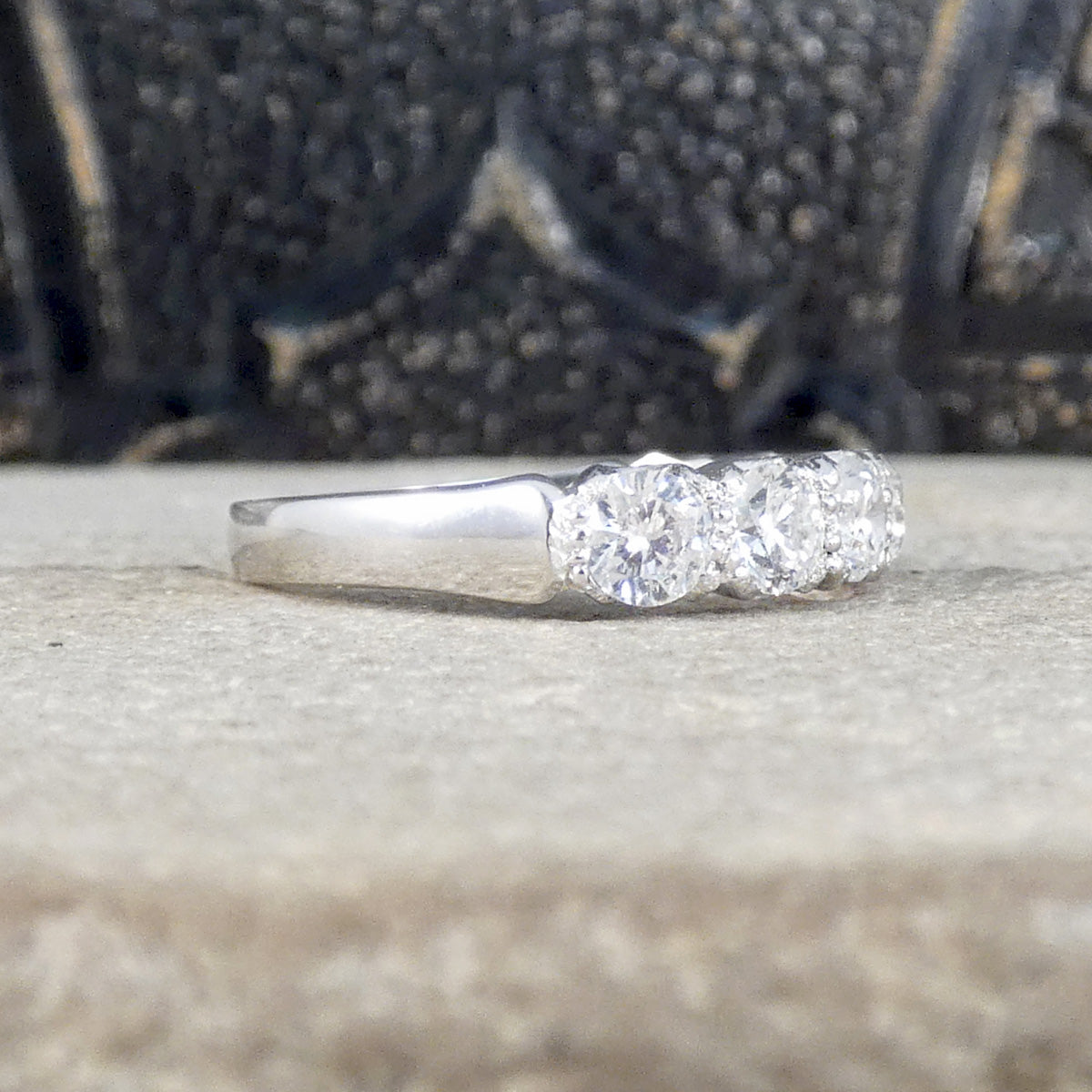 1.40ct Diamond Half Eternity Ring in 18ct White Gold. Featuring a row of brilliant cut diamonds creating sparkle across the whole finger. Side view showing how far the diamonds go around the finger.