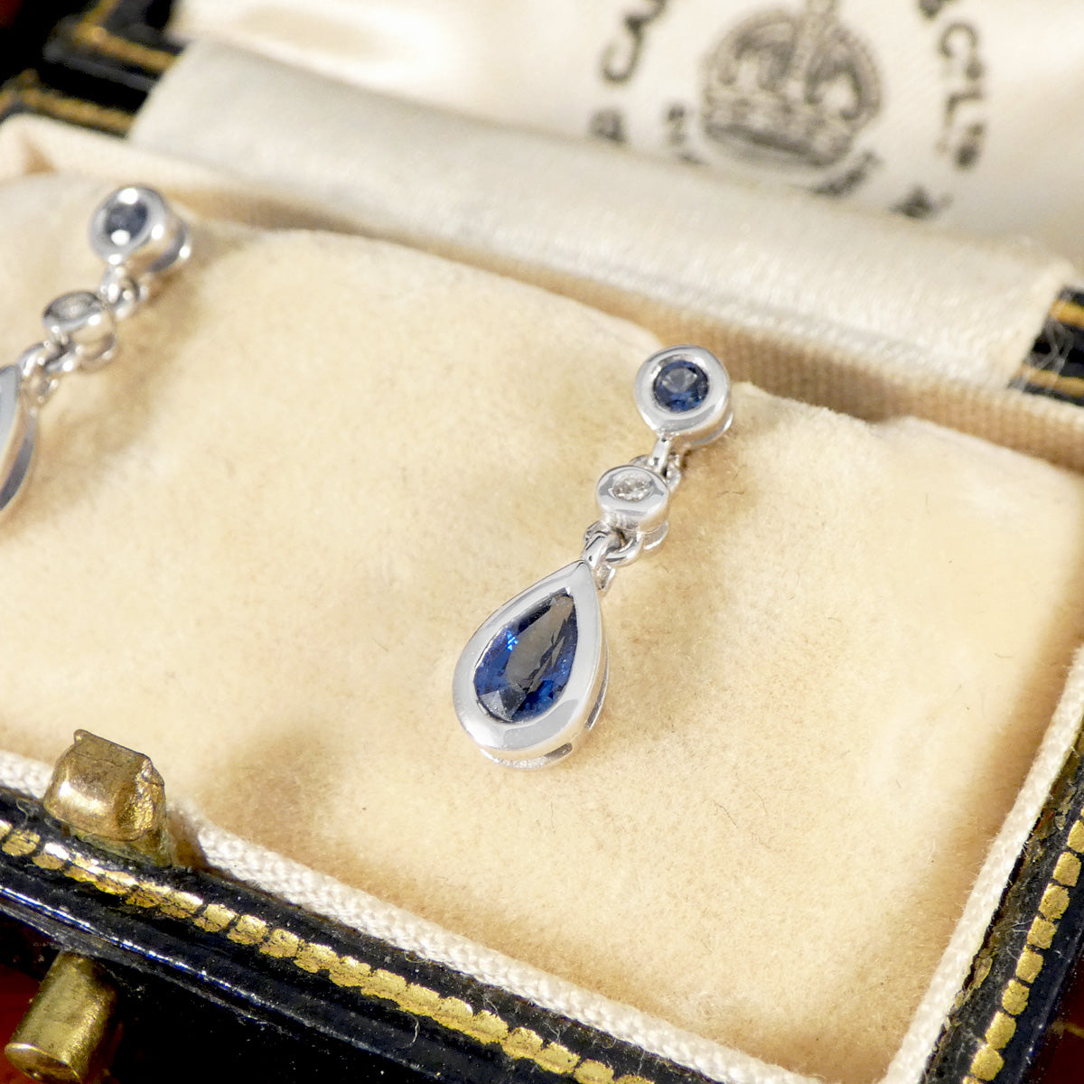 A single Sapphire and Diamond Stud Drop earring sin 18ct white gold.