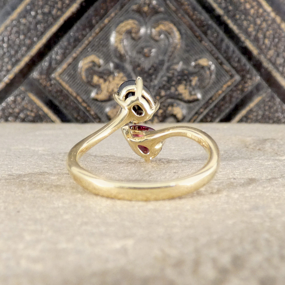 Two stone twist ring shown from the back in gold.