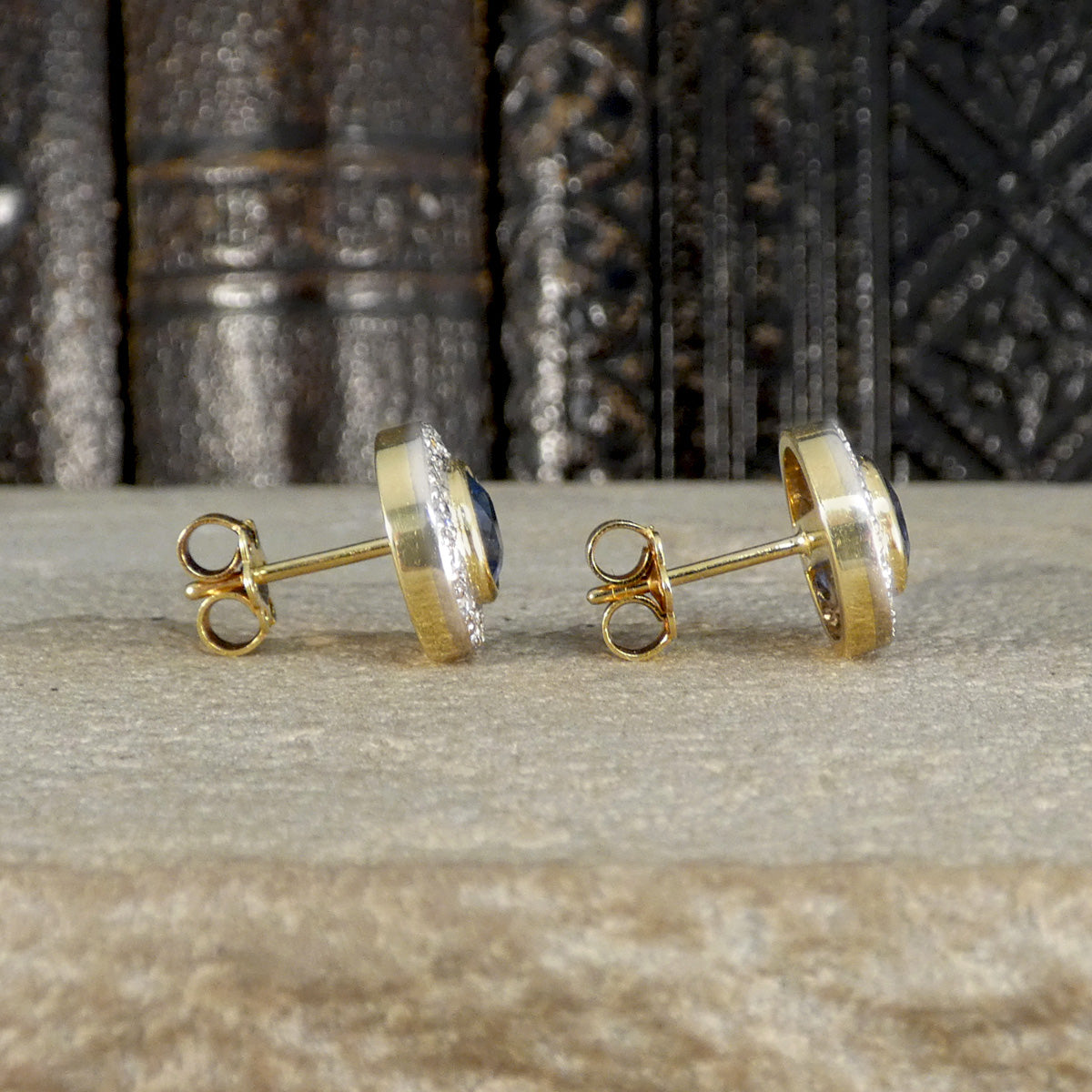 Side view of Gold stud earrings.