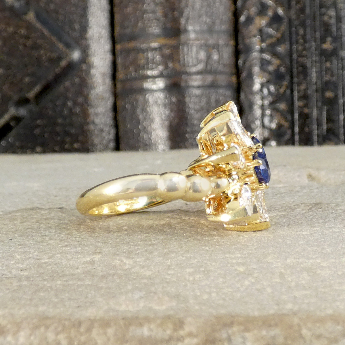 Side profile of Kuchinskky ring in 18ct yellow gold with a plain polished band and bubble shoulders.