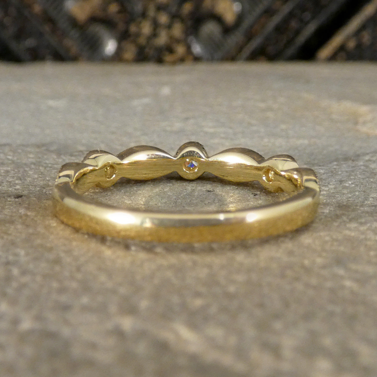 Gold ring on a textured surface