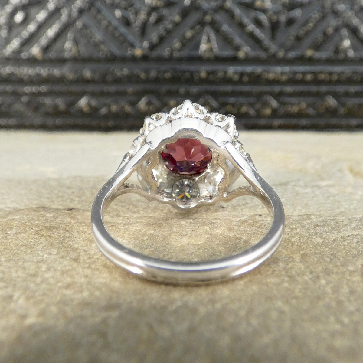 Back view of 2.00ct Pyrope Garnet and 1.40ct Brilliant Cut Diamond flower cluster ring in 18ct White Gold with Yellow Gold claws on the Garnet. Showing settings and gallery.