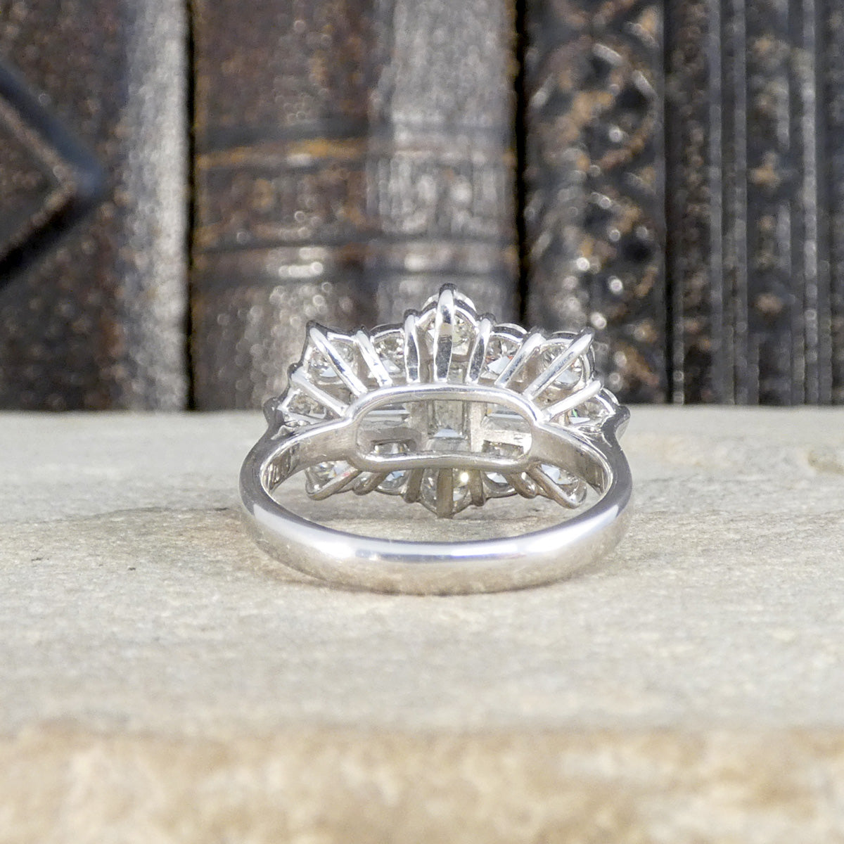 Back view of diamond cluster ring showing open setting allowing light to dance through the diamonds.