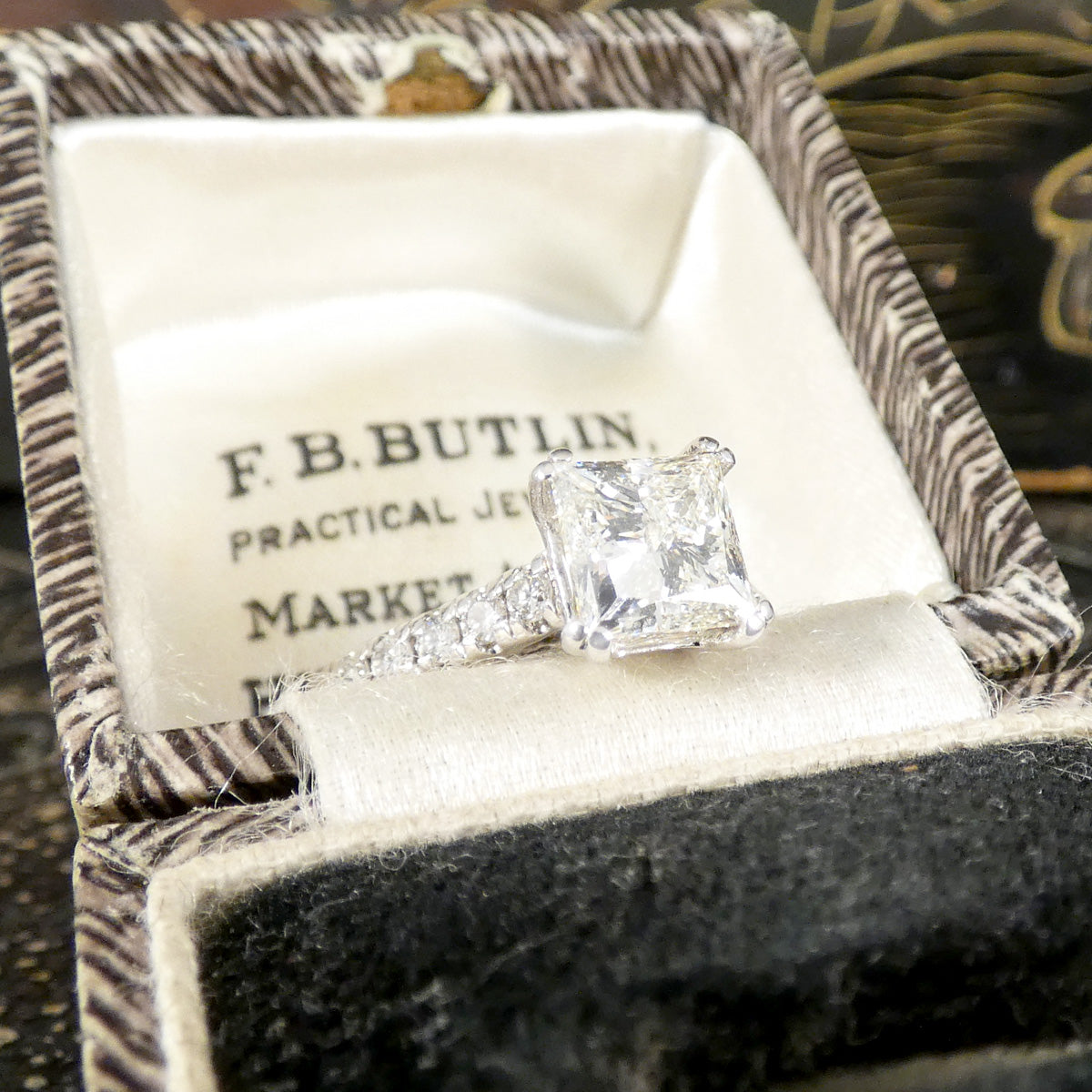A gorgeous Princess cut Diamond Solitaire ring with diamond set shoulders in 18ct White Gold, the perfect engagement ring. Bright and beautiful natural diamond ring.