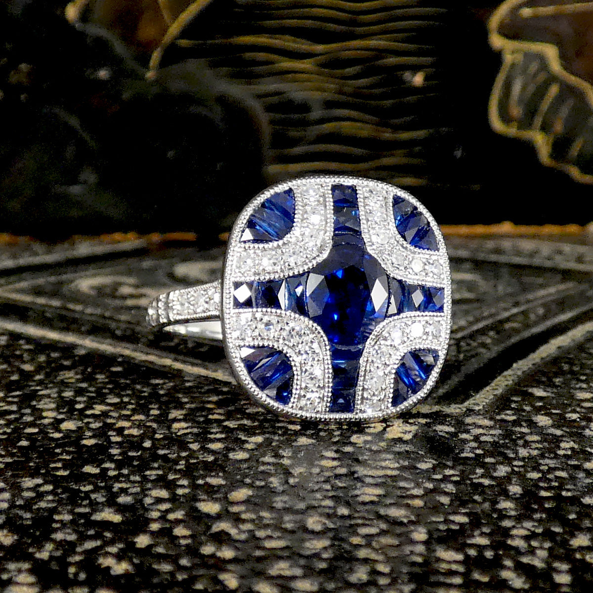 A gorgeous Art Deco style Sapphire and Diamond geometric cross style ring in Platinum. The perfect gift.